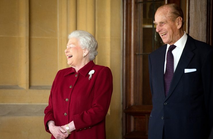 Britain’s Queen Elizabeth and Prince Philip laugh after bidding farewell to the President of Ireland Michael D. Higgins and his wife Sabina at Windsor Castle in Windsor