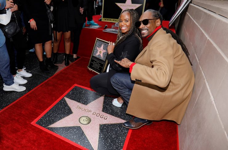 Rapper Snoop Dogg poses for a picture with his wife Shante Broadus after receiving his star on “Hollywood Walk of Fame” in Los Angeles