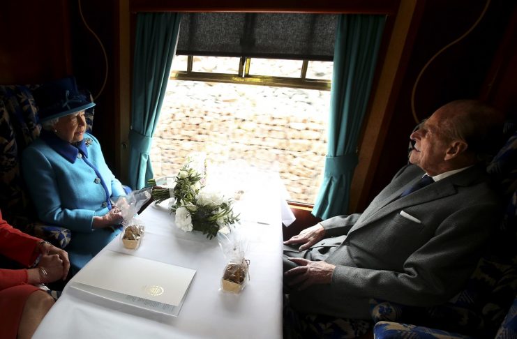 Britain’s Queen Elizabeth travels with Prince Philip on the new Scottish Borders railway line, in Scotland