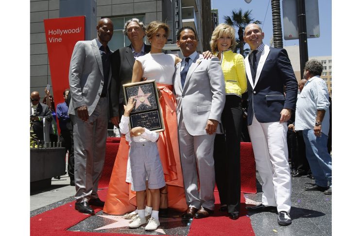 Lopez poses with Wayans, Nava, her two kids Max and Emme, Medina, Fonda and Pitbull, after her star was unveiled on the Walk of Fame in Hollywood