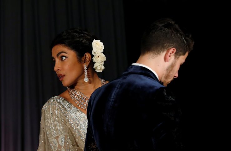 Bollywood actress Priyanka Chopra and her husband singer Nick Jonas leave after a photo opportunity at their wedding reception in New Delhi