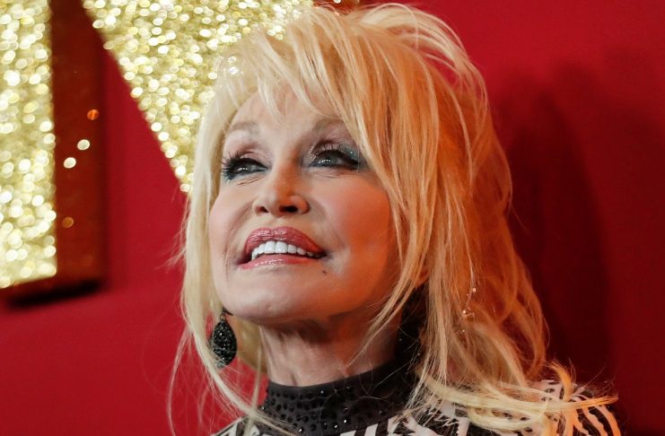 Dolly Parton poses at a premiere for the movie Dumplin’ in Los Angeles, California
