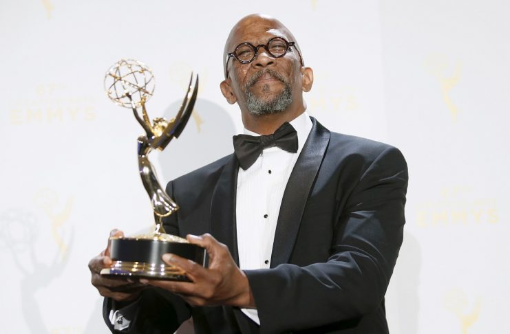 Cathey poses with his outstanding guest actor in a drama series award for “House of Cards” backstage at the 2015 Creative Arts Emmy Awards in Los Angeles