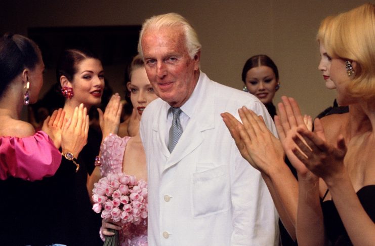 French fashion designer Hubert de Givenchy is applauded by the models after he presented his last Hi..