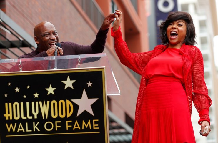 Actor Taraji P. Henson reacts as her friend director John Singleton introduces her at Henson’s ceremony to receive a star on Hollywood’s Walk of Fame in Los Angeles