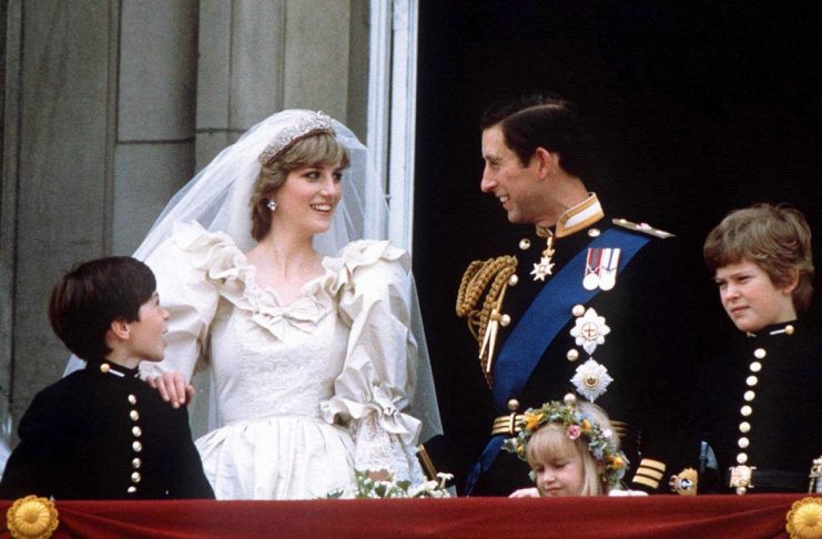 Prince Charles and Princess Diana stand on the balcony of Buckingham Palace following their wedding at St. Pauls Cathedral