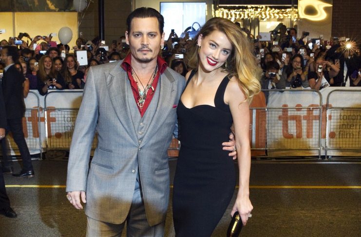 Actors Johnny Depp and his wife Amber Heard arrive for the premiere of the movie “Black Mass” at TIFF the Toronto International Film Festival in Toronto.