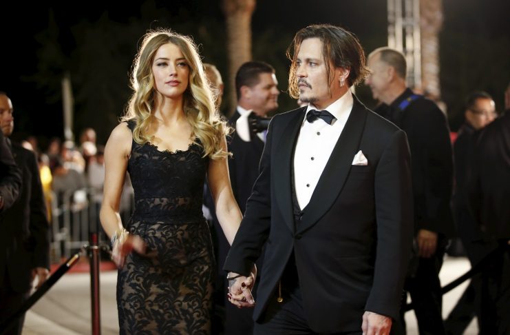 File photo of Desert Palm Achievement Award recipient actor Johnny Depp and wife actress Amber Heard posing at the 27th Annual Palm Springs International Film Festival Awards Gala in Palm Springs