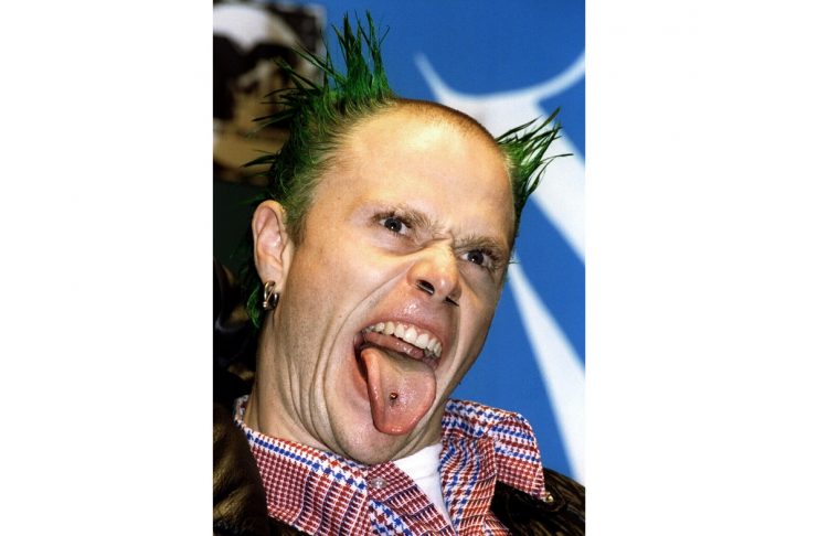 The Prodigy lead singer Keith Flint sticks out his tongue at press photographers during the 1996 MTV..