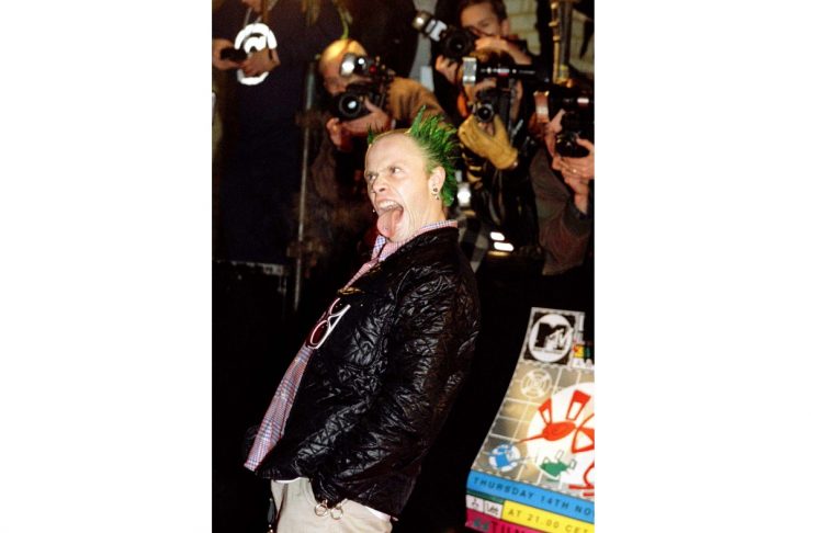 Keith Flint of the British techno group ‘The Prodigy’ sticks out his tongue as he arrives at the Eur..