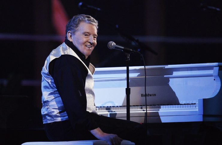 Jerry Lee Lewis smiles after performing during the first of two 25th Anniversary Rock & Roll Hall of Fame concerts in New York