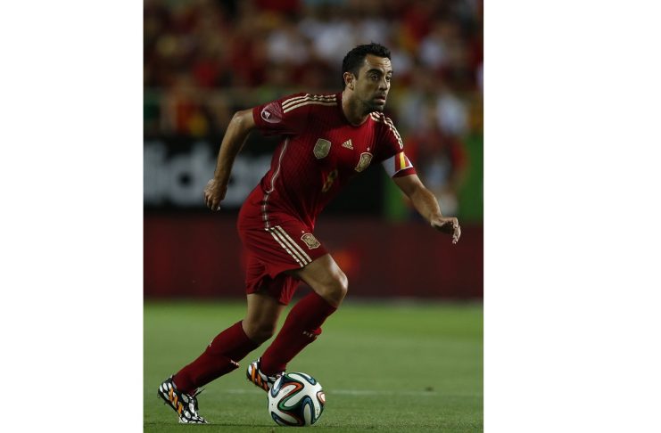 Spain’s Xavi controls the ball during their international friendly soccer match against Bolivia in Seville